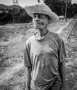 contemplative farmer with straw hat