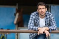 contemplative man at equestrian stables Royalty Free Stock Photo