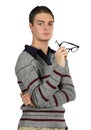 A Contemplative Man Holds His Glasses