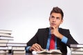 Contemplative man reads at desk