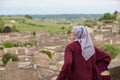 Contemplative nun over a nice old city Royalty Free Stock Photo