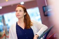 contemplative woman in cinema lobby