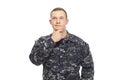 Contemplative young navy man with hand on chin