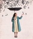 Contemporary art collage of beautiful woman in rain coat standing with umbrella under falling music notes isolated over Royalty Free Stock Photo