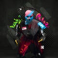 Contemporary art collage. Medieval knight in neon colored balaclava with letterings around isolated over black