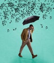 Contemporary art collage of serious man in suit walking with umbrella under falling music notes isolated over mint Royalty Free Stock Photo