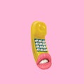 Yellow telephone with lips.
