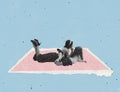Contemporary art collage. Young woman and little girl lying on pink paper carpet isolated over blue background Royalty Free Stock Photo