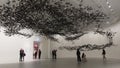 Contemporary art installation of starling flock swarms overhead