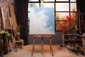 Contemporary art studio Wooden easel, blank canvas, a thriving artists sanctuary Royalty Free Stock Photo