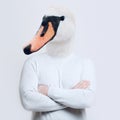 Contemporary artwork collage concept. Portrait of man with head of swan against white background