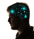 Contemporary artwork. Silhouette of young man with neon drawings of brain in his head. Artwork. Artificial intelligence Royalty Free Stock Photo