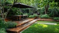 A contemporary backyard patio featuring a large dining table, black umbrellas, and an integrated grill set amid lush vegetation