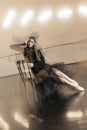 Contemporary ballet dancer on a wooden chair on a repetition Royalty Free Stock Photo