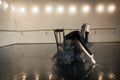 Contemporary ballet dancer on a wooden chair on a repetition Royalty Free Stock Photo