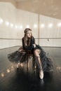 Contemporary ballet dancer on a wooden chair on a repetition Royalty Free Stock Photo