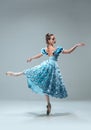 Contemporary ballroom dancer on grey studio background