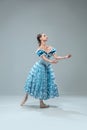 Contemporary ballroom dancer on grey studio background