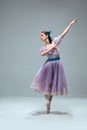 Contemporary ballroom dancer on grey studio background