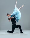 Contemporary ballroom dancers on grey studio background Royalty Free Stock Photo