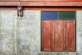 Contemporary bare concrete wall and old wood window