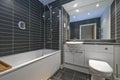 Contemporary bathroom with black tiles Royalty Free Stock Photo