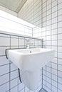 Contemporary bathroom detail with retro tiled wall Royalty Free Stock Photo