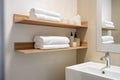 Contemporary bathroom with an empty wall and a small shelf holding neatly folded towels. Generative AI