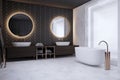 Contemporary bathroom interior with round mirrors and washbasin.