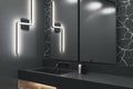 Contemporary black bathroom interior with washbasin and mirrors.