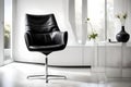 A contemporary black leather chair positioned against a sleek white wall, accentuated by soft natural light Royalty Free Stock Photo