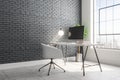 Contemporary brick interior with designer workplace Royalty Free Stock Photo