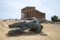 Contemporary bronze statue of fallen Icarus in front of Temple of Concordia, Agrigento Royalty Free Stock Photo