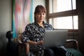 Contemporary, Brunette, Business woman working on laptop from home office Royalty Free Stock Photo