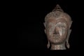 Contemporary Buddhism. The future of religion. High contrast image of metallic buddha head.