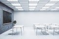 Contemporary classroom with empty black chalkboard