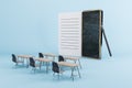 Contemporary classroom with oversized notepad and smartphone, interactive education concept.