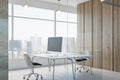 Contemporary concrete office interior with empty mock up place on computer monitor, furniture, equipment, window with city view Royalty Free Stock Photo