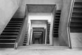 Contemporary concrete staircase with wooden handrail