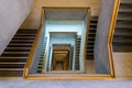 Contemporary concrete staircase with wooden handrail