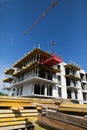 Contemporary Construction Site Featuring a Crane and Various Building Materials Present Royalty Free Stock Photo