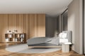 Contemporary cozy bedroom interior with wooden wardrobe and grey bed Royalty Free Stock Photo