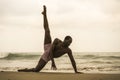 Contemporary dance choreographer and dancer doing ballet beach workout . a young attractive and athletic black African American Royalty Free Stock Photo