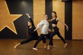 Contemporary dance performers posing in studio