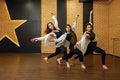 Contemporary dance performers posing in studio