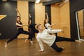 Contemporary dance performers posing in studio