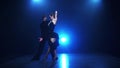 Contemporary dancing pair of professional dancers in slow motion, smoke