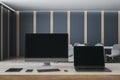 Contemporary designer office desktop with empty mock up computer screens, supplies and interior background. 3D Rendering