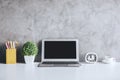 Contemporary desk with empty laptop