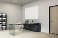 Contemporary director`s office with blank poster on wall
